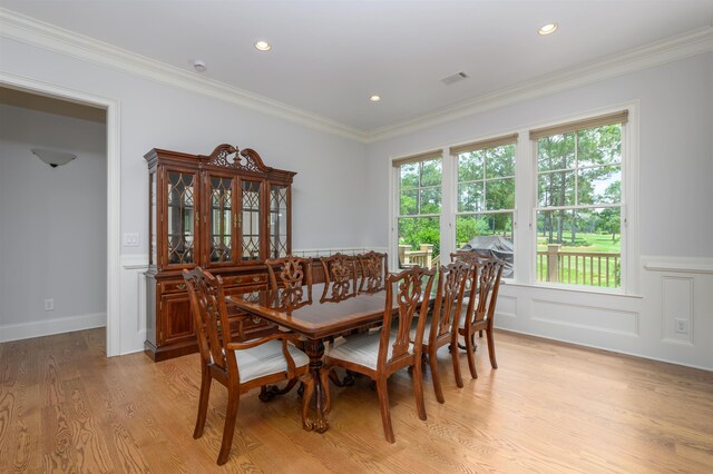 1020 Fairway Ridge Cir, Greensboro, GA 30642 - dining space with light wood-style floors, ornamental molding, a wainscoted wall, and recessed lighting