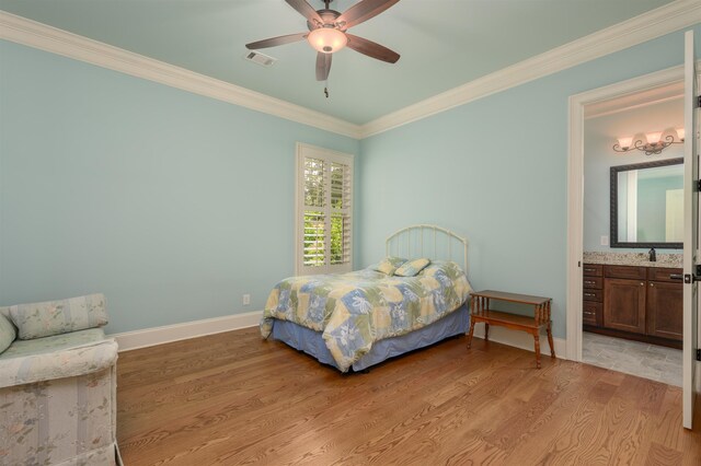 1020 Fairway Ridge Cir, Greensboro, GA 30642 - bedroom with ornamental molding, light wood finished floors, baseboards, connected bathroom, and a ceiling fan