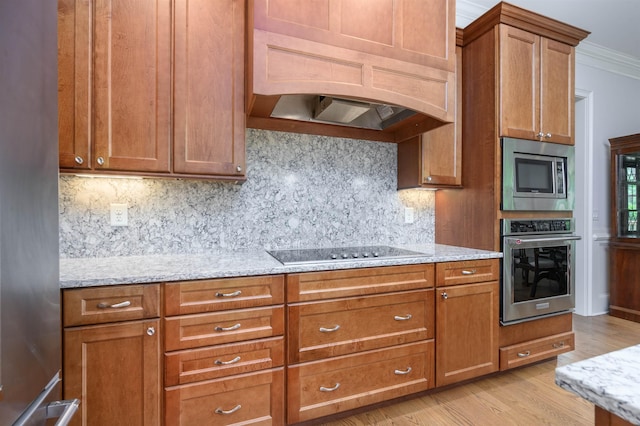 1020 Fairway Ridge Cir, Greensboro, GA 30642 - kitchen with stainless steel appliances, brown cabinets, light stone countertops, decorative backsplash, and ornamental molding