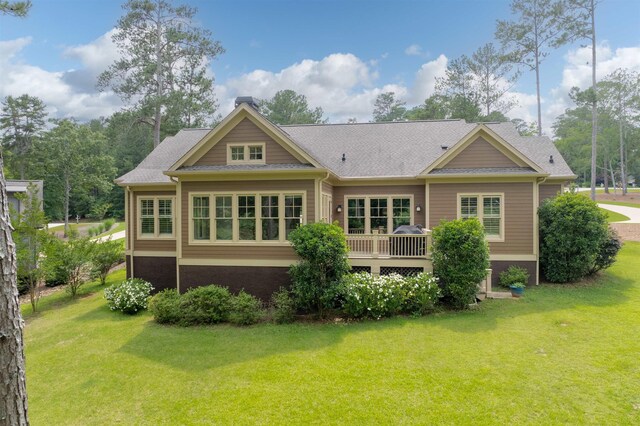 1020 Fairway Ridge Cir, Greensboro, GA 30642 - rear view of property featuring a lawn and roof with shingles