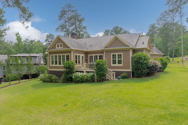 1020 Fairway Ridge Cir, Greensboro, GA 30642 - rear view of property featuring a deck, a lawn, a chimney, and stairway