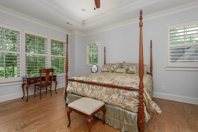 1020 Fairway Ridge Cir, Greensboro, GA 30642 - bedroom featuring wood finished floors, multiple windows, baseboards, crown molding, and a ceiling fan
