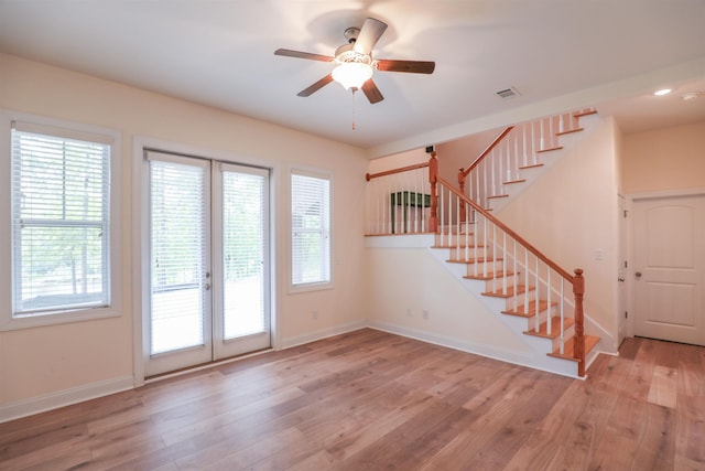 doorway featuring french doors, ceiling fan, and light hardwood / wood-style flooring