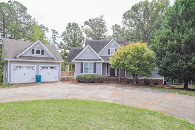 craftsman-style home featuring a garage and a front lawn