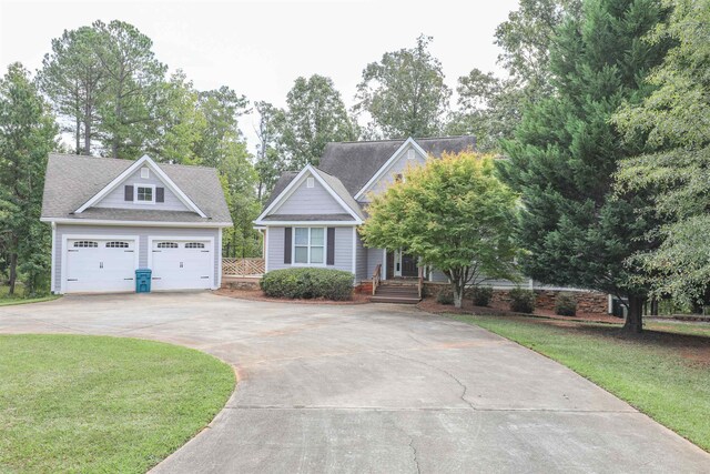 view of front facade with a garage and a front lawn