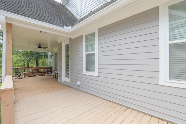 wooden terrace featuring ceiling fan