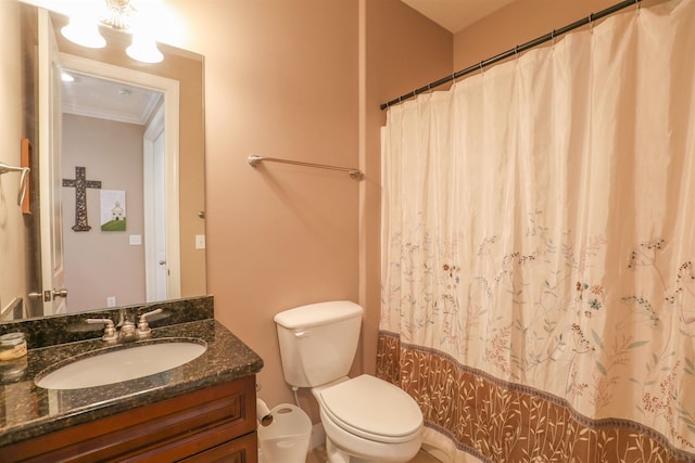 bathroom with vanity, walk in shower, crown molding, and toilet