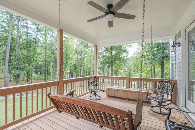 wooden deck featuring ceiling fan