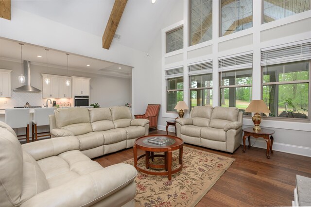 living room with high vaulted ceiling, dark hardwood / wood-style floors, and beamed ceiling