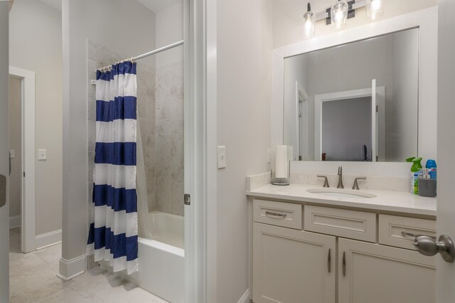 bathroom featuring tile patterned flooring, shower / bath combo, and vanity