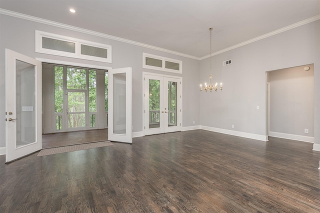 1051 Liberty Bluff Rd, Greensboro, GA 30642 - empty room with french doors, a chandelier, baseboards, ornamental molding, and dark wood finished floors