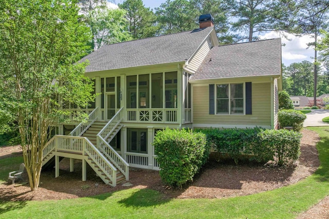 1051 Liberty Bluff Rd, Greensboro, GA 30642 - back of property featuring a sunroom, stairs, a shingled roof, and a chimney
