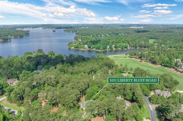 1051 Liberty Bluff Rd, Greensboro, GA 30642 - aerial view of property's location featuring a large body of water, a heavily wooded area, property boundaries highlighted, and a golf club