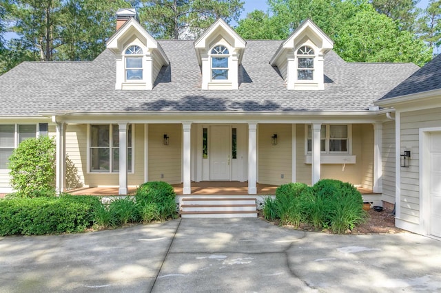 1051 Liberty Bluff Rd, Greensboro, GA 30642 - cape cod-style house with a porch, roof with shingles, and a chimney