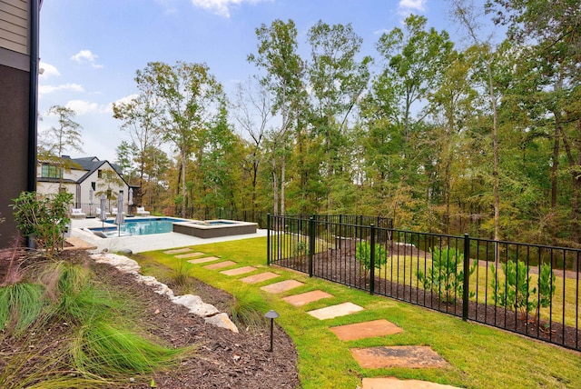 view of yard with a swimming pool with hot tub and a patio