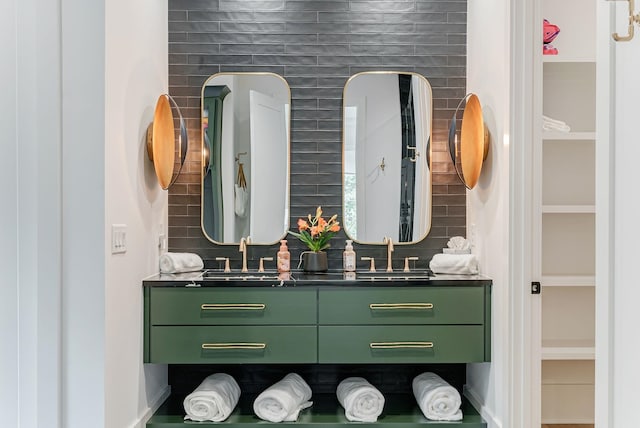 bathroom featuring tasteful backsplash and vanity