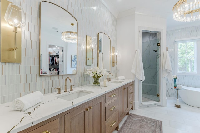 bathroom featuring independent shower and bath, tasteful backsplash, tile walls, vanity, and a notable chandelier