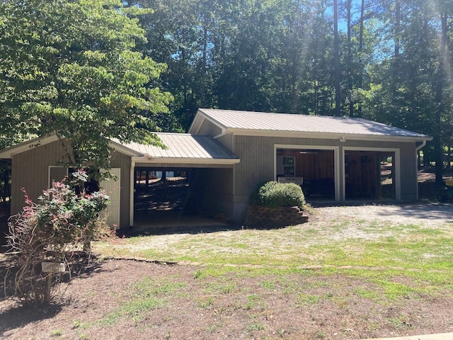 view of side of property with a carport