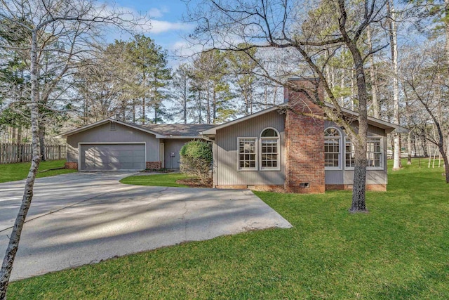 view of front of property with a garage and a front yard