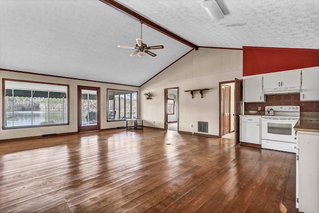 interior space featuring a textured ceiling, lofted ceiling with beams, dark hardwood / wood-style floors, and ceiling fan