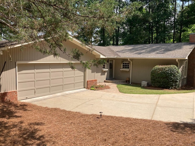 single story home featuring a garage