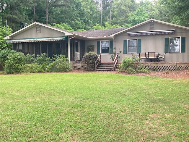 ranch-style home with covered porch and a front lawn