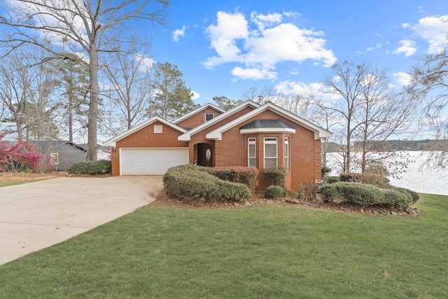 view of front of home with brick siding, an attached garage, concrete driveway, and a front lawn