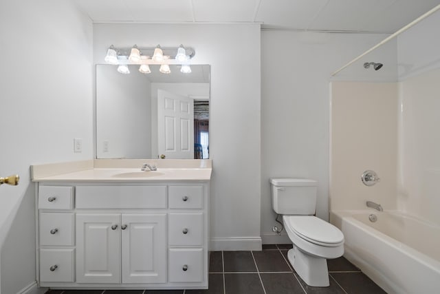 bathroom featuring tile patterned floors, toilet, shower / tub combination, baseboards, and vanity