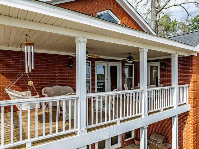 wooden terrace with grilling area and ceiling fan