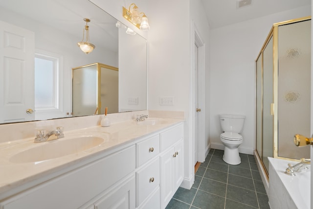 bathroom featuring double vanity, tile patterned floors, a stall shower, and a sink