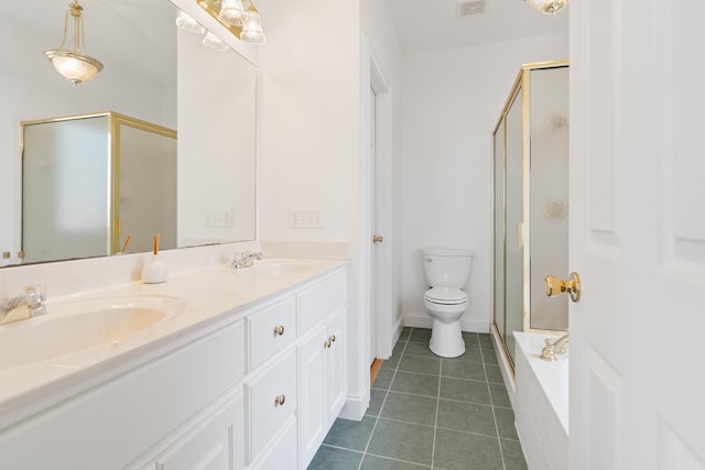 bathroom with a sink, double vanity, a shower stall, and tile patterned flooring