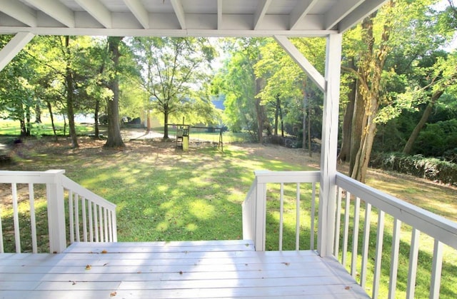 wooden deck with a yard