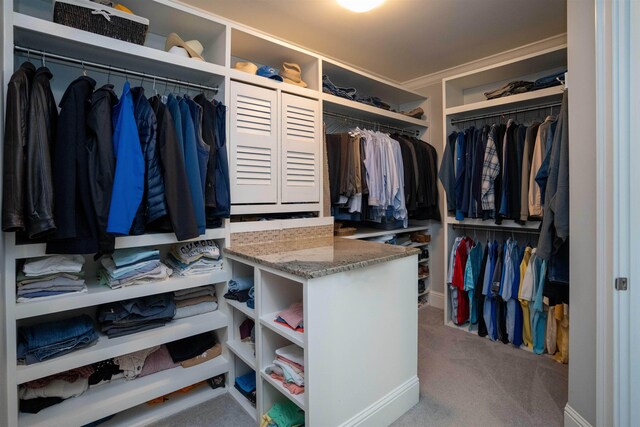 spacious closet with carpet flooring