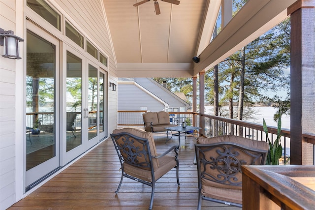 wooden deck featuring ceiling fan