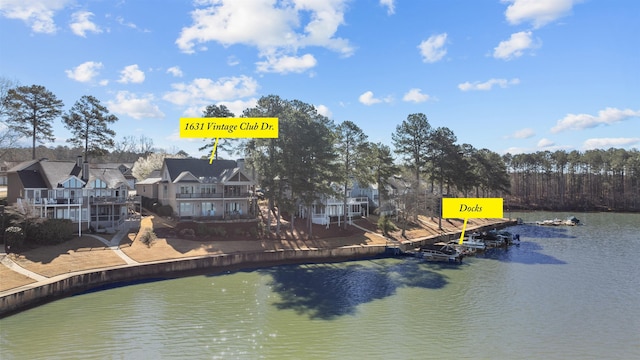 property view of water featuring a residential view and a boat dock