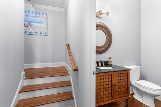 stairs featuring crown molding and baseboards