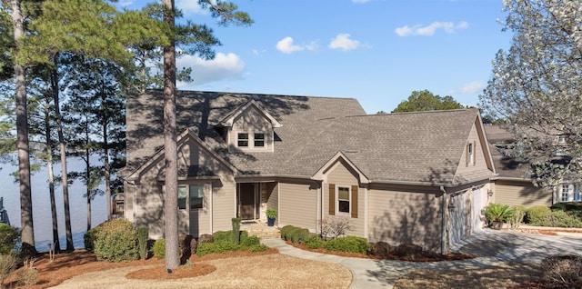 view of front of house featuring concrete driveway and an attached garage