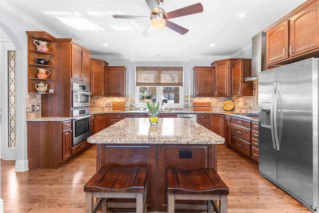 kitchen featuring ventilation hood, ceiling fan, arched walkways, stainless steel appliances, and open shelves