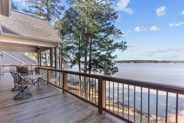 wooden deck featuring a water view