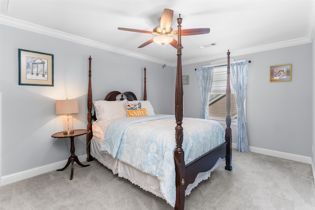 carpeted bedroom featuring a ceiling fan, crown molding, baseboards, and visible vents