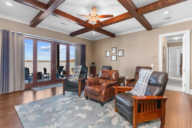 living room featuring beam ceiling, coffered ceiling, and wood-type flooring