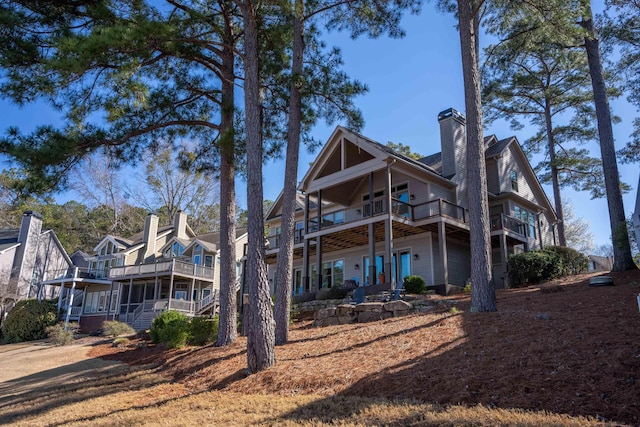 rear view of property with a balcony