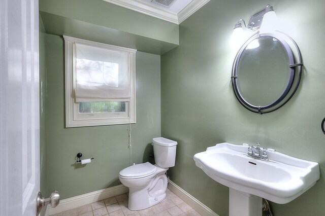 243 Riverbend Dr, Eatonton, GA 31024 - half bathroom featuring crown molding and tile patterned flooring
