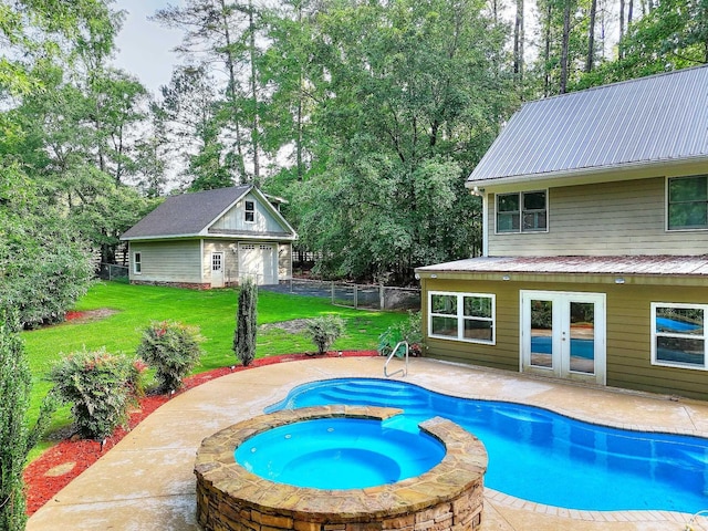 243 Riverbend Dr, Eatonton, GA 31024 - view of swimming pool with a patio, view of wooded area, a pool with connected hot tub, and an outdoor structure