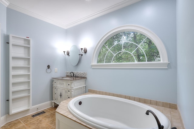 243 Riverbend Dr, Eatonton, GA 31024 - bathroom featuring vanity, a garden tub, crown molding, and tile patterned flooring