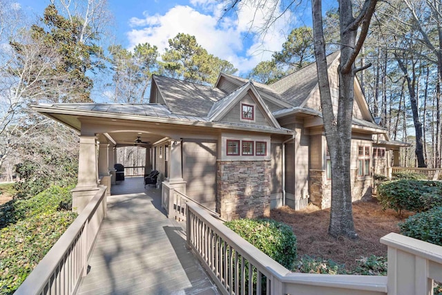 view of side of home featuring ceiling fan