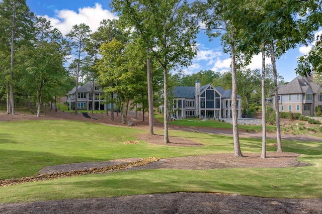 view of community featuring a yard