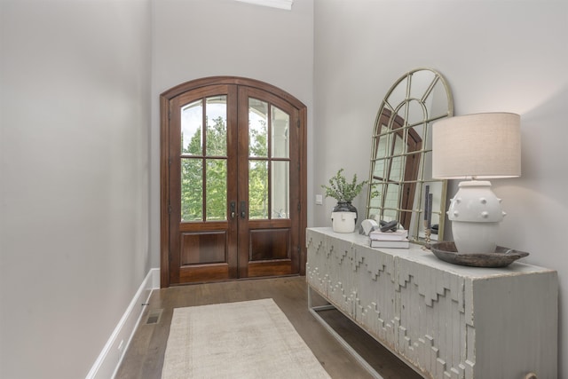 foyer with french doors and dark wood-type flooring