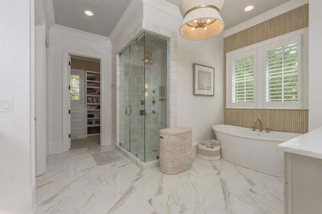 bathroom featuring crown molding, separate shower and tub, a wealth of natural light, and a notable chandelier