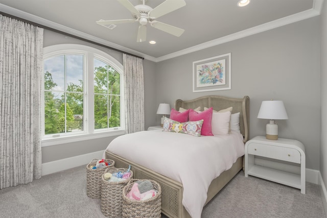 bedroom featuring crown molding, ceiling fan, and light carpet